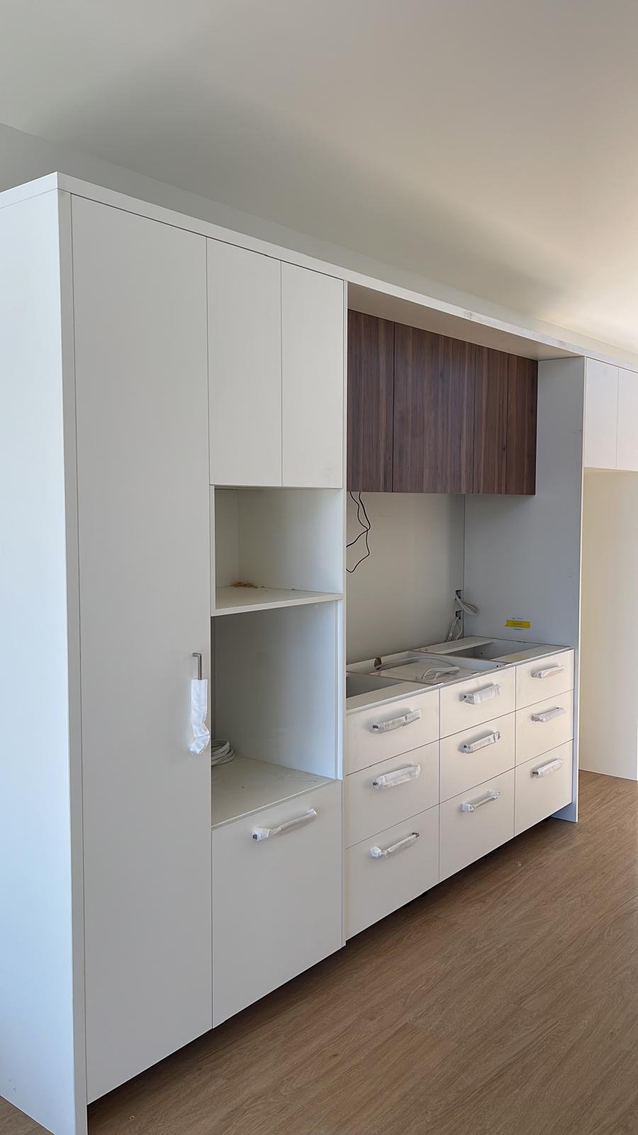 Herringbone splashback and oak shelving